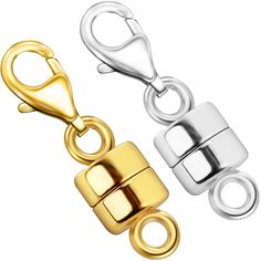 two gold and silver metal clasps on each side, one with an open shack