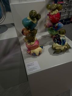 some glass figurines are on display in a store