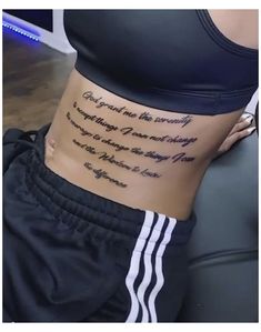 a woman with a tattoo on her stomach