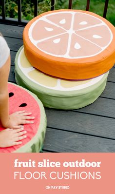 an image of fruit slice outdoor floor cushions on a deck with text overlay that reads, fruit slice outdoor floor cushions