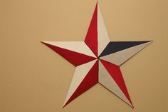 a red, white and blue star hanging on the wall