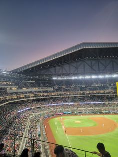 a baseball stadium filled with lots of people