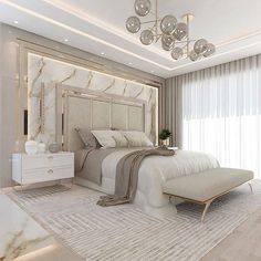 a large white bed sitting in the middle of a bedroom next to a tall window