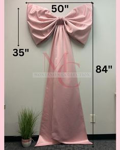 the measurements for a long pink dress with a bow on it's back and side