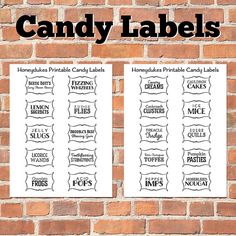 two white labels on a brick wall with the words candy labels in black and white