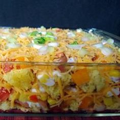 a casserole dish filled with vegetables and cheese