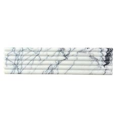 marble pencils are lined up on top of each other, with black and white lines