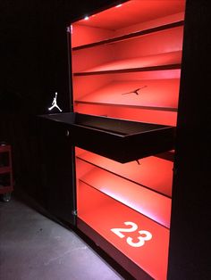 an illuminated display case in the shape of a basketball hoop