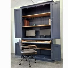 an office chair sitting in front of a computer desk