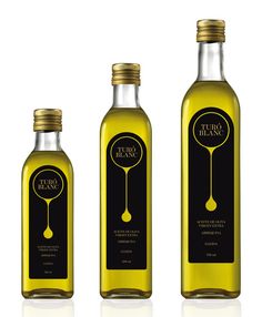 three bottles of olive oil are shown in this image, one is yellow and the other is black