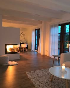 a living room filled with furniture and a fire place