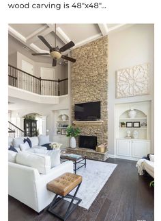 a living room filled with furniture and a flat screen tv mounted on the wall above a fireplace