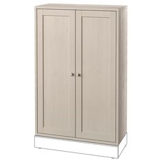 a tall white cabinet with two doors