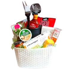 a white basket filled with food and condiments