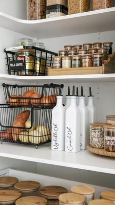 an open pantry with bread, milk and other items on the shelves in front of it