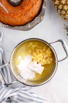 pineapple bundt cake in a pan with ingredients next to it