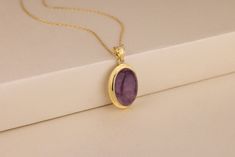 This gorgeous and stylish 10K,14K gold and silver necklace is a must have for any women's jewelry collection. The amethyst gemstone pendant is accented with diamonds with its center stone surrounded by three gems. This beautiful piece of jewelry makes a great gift to give as well as receive! Details of the product Material: 10K and 14K Solid Gold, Silver Gemstone: Amethyst Gemstone Gemstone Size: 12x16 mm Unique Gift For people whom you love; Mom, Girlfriend, Wife, Fiance, Best Friend; Dainty Gift Idea; Valentine's Day Gift, Birthday Gift, Anniversary Gift, Gift For Engagement or Wedding, Promise Gift, Christmas Gift, Black Friday Gift, Mother's Day Gift, International Women's Day Gift, Memorial Gift. By gifting this elegant product to the most special person in your life, you can make the Gemstone Pendant Design, Elegant Gold Amethyst Birthstone Necklace, Yellow Gold Amethyst Necklace Hallmarked, Gold Amethyst Jewelry With Polished Finish, Purple Oval Pendant Necklace For Anniversary, Elegant Purple Locket Jewelry, Fine Jewelry Amethyst Necklace With Round Pendant, Fine Jewelry Amethyst Round Pendant Necklace, 14k Gold Purple Round Pendant Jewelry