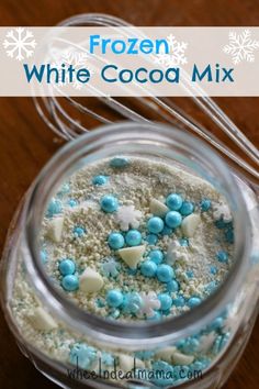 frozen white cocoa mix in a jar with blue and white sprinkles