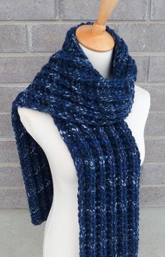 "This beautiful hand knitted scarf is made with Super Bulky and Soft Wool Blend Yarn (80% Acrylic, 20% Lambswool). Classic ribbed pattern, it looks the same on both sides. The scarf can be worn in multiple ways. Very beautiful colors: shades of navy, blue, and light blue. The colors may appear slightly different on different monitors. Measures: 63\"- 65\" (160-165 cm) long x 7\" (18 cm) wide. From a smoke-free home. Care instructions: Hand wash in cool water and dry flat." Blue Knitted Scarves For Winter, Blue Knitted Winter Scarves, Blue Yarn Knitting Pattern For Winter, Winter Blue Yarn Knitting Pattern, Winter Knitting Pattern In Blue Yarn, Blue Knitted Yarn Scarves, Blue Knitted Yarn Scarf, Blue Crochet Scarves For Winter, Cozy Blue Hand Knitted Pattern