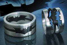 two wedding rings with batman symbols on them