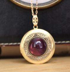 This raw brass locket has been layered with a vintage brass bezel  and set with a lovely 16mm Amethyst Gemstone cabochon.  It has been polished to a warm golden tone and sealed with a wax polish.  In time it will darken but can be polished back to golden or left to form its natural patina if desired. The locket is 30mm with 10mm bail and is hung from a matching 1x2mm brass link chain and finished with a brass lobster clasp. It will arrive in a velvet gift pouch. Victorian Antiques, Inspiration Art, Locket Necklace, Queen Anne, Amethyst Gemstone, Raw Brass, Link Chain, Vintage Brass, Locket