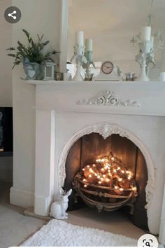 a living room with a fire place filled with candles