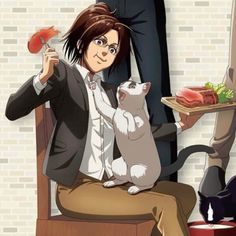 a woman sitting in a chair with a cat on her lap next to a plate of food