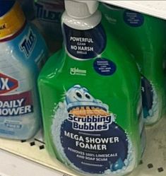 bottles of toothpaste and mouthwash are on display in a grocery store shelf