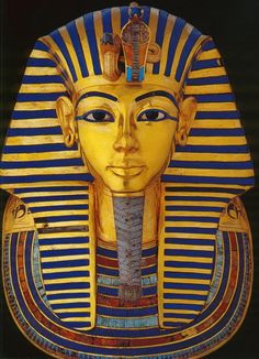 an egyptian mask with blue and yellow stripes