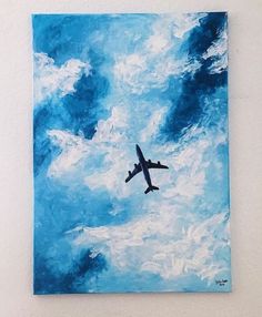 an airplane is flying through the blue sky