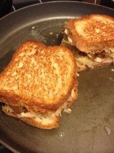 two grilled sandwiches sitting on top of a frying pan next to each other