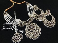 Gold plated Indian jewelry set.  Absolutely stunning necklace chandbali earrings and tika . The set is studded with purple colour stones and cream pearls. Beautiful craftsmanship. Traditional Hyderabadi design. Ideal for wedding, parties or mehndi brides. Gold plated.Please read our shop policies before making a purchase. Thanks Hyderabadi Jewelry Brides, Chandbali Necklace, Hyderabadi Jewellery, Hyderabadi Jewelry, Mehndi Brides, Chandbali Earrings, Indian Jewelry Sets, Pearl Jewelry Sets, Set Earrings