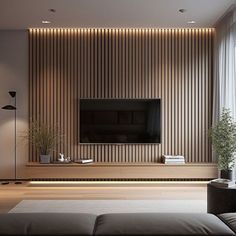 a living room with a large television mounted on the wall