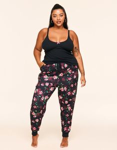 Meet your new favorite lounge set! Our Kaiden black cami and joggers set is made from super-soft ribbed-knit fabric with a hint of stretch for the coziest fit. The cami has adjustable straps, and the joggers have pockets and an elasticated waistband for a flattering and comfortable look. (Available in plus-sizes 1X-4X.) Black Cami, Joggers Set, Adore Me, Black Camis, Cozy Fits, Jogger Set, Ribbed Neckline, Lounge Set, Short Set