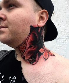 a man with a tattoo on his neck