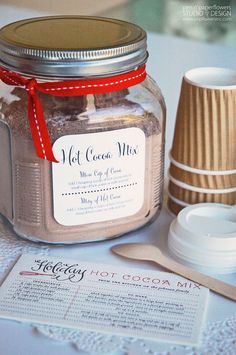 a jar of hot cocoa mix sitting on top of a table