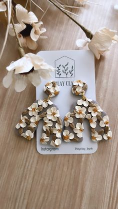 the earrings are made out of wood and flowers