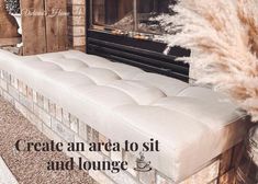 a white bench sitting in front of a fire place next to a window with the words create an area to sit and lounge