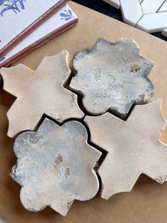 three pieces of cement sitting on top of a table