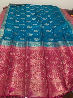 Handmade Khaaddi Banarasi Saree Bondi blue and Rani color Blue Cutdana Traditional Wear For Eid, Blue Saree For Eid With Traditional Drape, Blue Traditional Drape Saree For Eid, Festive Designer Blue Saree, Blue Silk Traditional Wear With Handloom, Designer Blue Semi-stitched Saree, Blue Semi-stitched Designer Saree, Blue Saree With Traditional Patterns For Festivals, Blue Designer Saree For Festivals