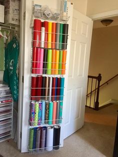 the closet is filled with many different colored spools