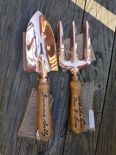 three forks and spoons are wrapped in burlap