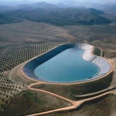 an aerial view of a large pool in the middle of nowhere