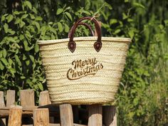 French Market Basket with Hot-Stamped Merry Christmas Logo - Handmade French Baskets Straw Bag Celebrate the festive season in style with our Handmade French Market Basket, featuring a Hot-Stamped Merry Christmas Logo. This artisanal straw bag combines traditional craftsmanship with a touch of holiday cheer, making it the perfect accessory for your market trips or casual outings during the holiday season. Handwoven from natural, eco-friendly straw, this French market basket is not only stylish b Luxury Beige Straw Bag For Market, Chic Basket-shaped Shopping Bag, French Market Basket Straw Bag, Eco-friendly Beige Basket Straw Bag, Christmas Logo, French Market Basket, French Baskets, French Market, Market Baskets