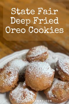 some powdered sugar donuts are on a plate with the words state fair deep fried oreo cookies