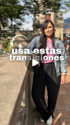 a woman standing next to a wall with the words usa ests transites on it