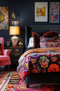 a bedroom with an ornate bed and colorful furniture