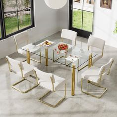 The 7-piece dining table set is a perfect addition to your dining space, this glass-top dining table will add elegance to your home kitchen and dining room while its ultra-modern design can easily blend in with any decor. 6 Dining chairs and a large dining table provide ample space for entertaining a small group of family or friends. Best of all, it's scratch-, water-, and stain-resistant. Mercer41 Chair Color: Beige, Size: 30"H x 63"L x 35.4"W | Mercer41 7 - Piece Glass Top Dining Set Upholste… Dining Chairs Classic, Rectangle Glass Dining Table, Glass Dining Table Set, Decorative Styles, Kitchen Table Set, Glass Top Dining Table, Chair Metal, 4 Dining Chairs, Large Dining Table