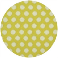 a yellow background with white polka dots