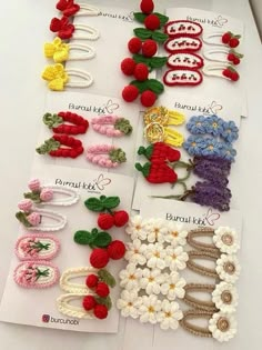 several crocheted hair clips are laid out on a table